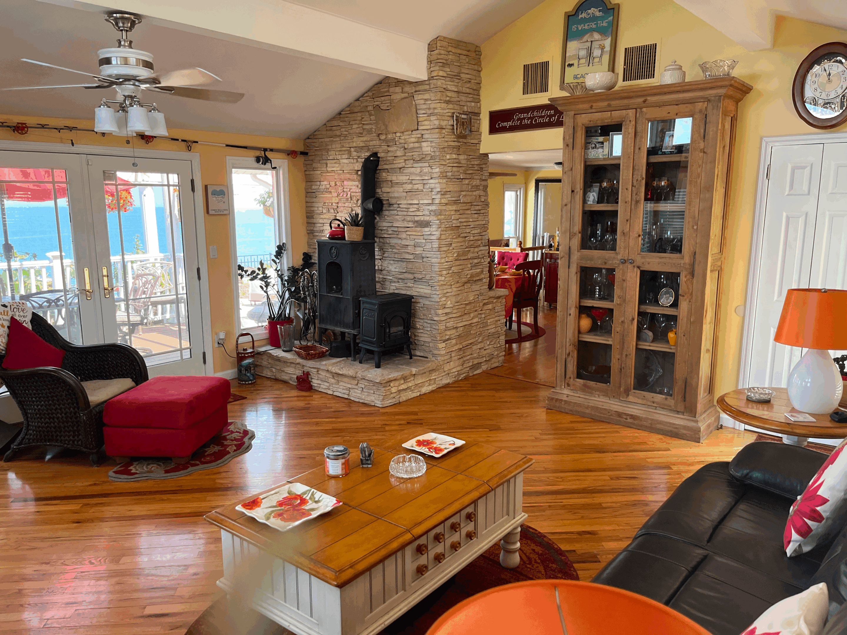 Cozy living room with fireplace, wooden furniture, and warm lighting.